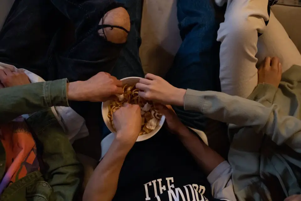 A veterinarian gently palpating a dog&#x27;s abdomen during a wellness exam