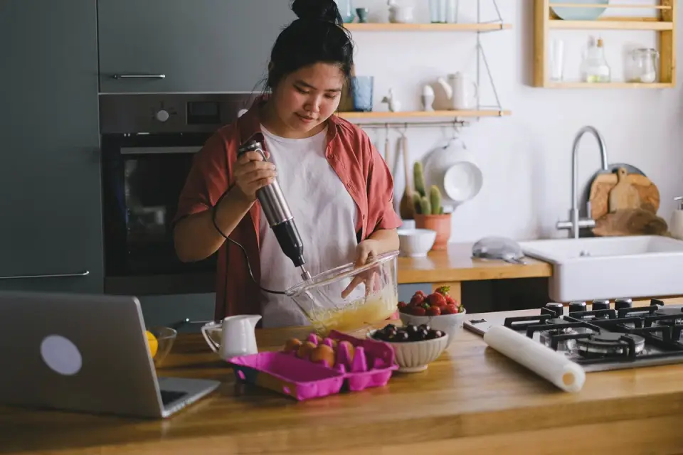 Dog owner preparing a meal